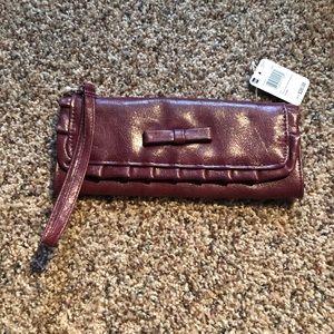 Mundi ruffle my bow elongated wristlet: mauve